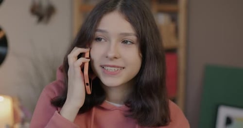 Teenage Girl Talking on Cell Phone Indoors