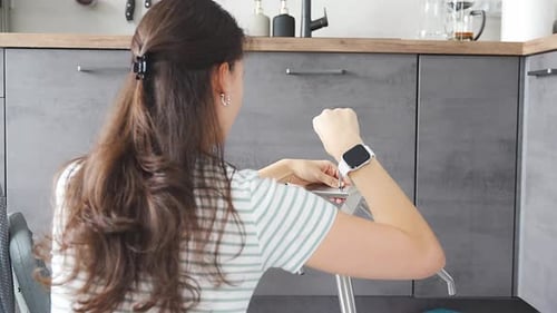 Woman Assembling Furniture with Screwdriver Indoors