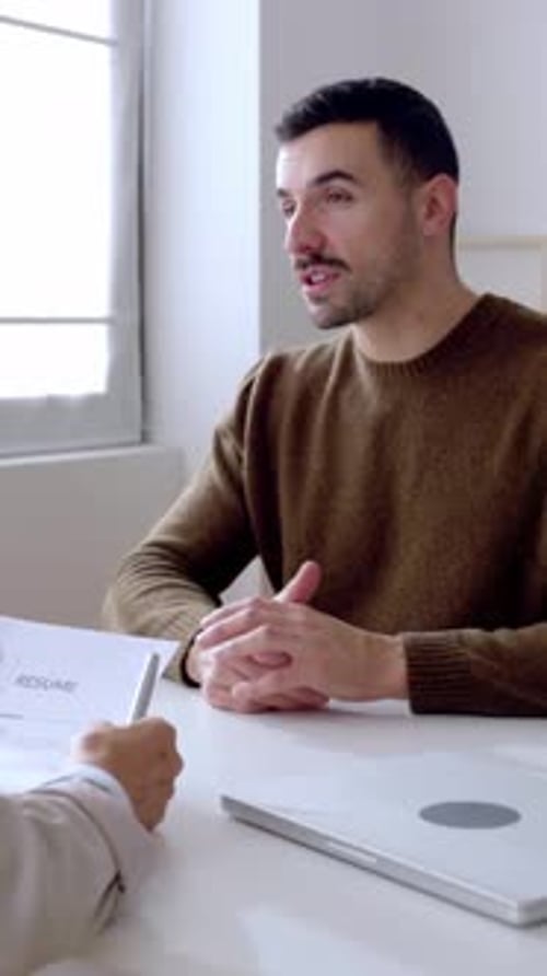 Young Man Doing a Job Interview with a Human Resources Worker