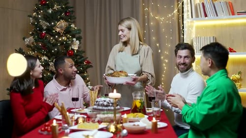 Friends Gathering for Festive Christmas Dinner Indoors