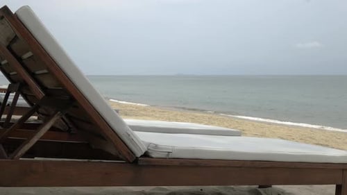 Close up part of a sunbed on the beach of Thailand, no people, blurred background of sea and sky.
