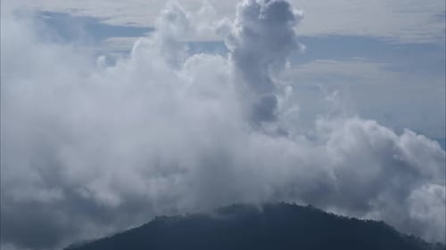 Aerial view of sea of fog on tropical mountains in the early morning.