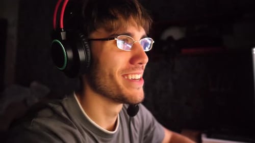 Young Adult Gaming at Home at Night