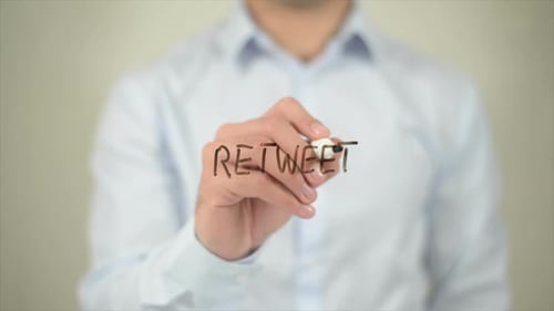 Retweet Man Writing on Transparent Screen