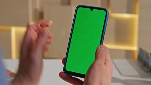 Man Hand Holding Greenscreen Smartphone in Office Closeup Unrecognizable Worker