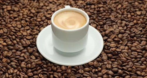 Coffee Cup with Coffee Beans Close Up