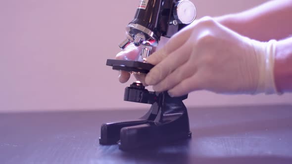 Scientist calibrating the micoscope for the specimen., Science Stock ...