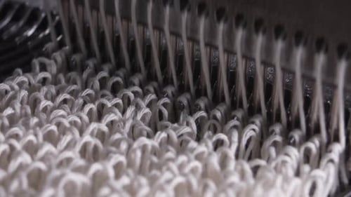 Closeup of Weaving Mechanism is Fabricating Synetic MOP