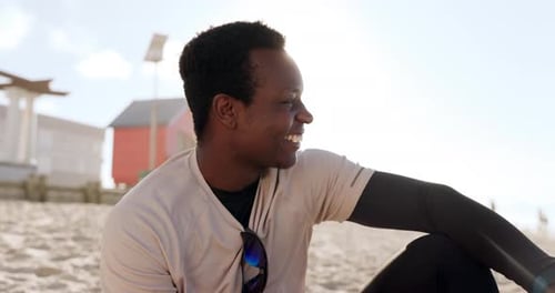 Travel, happy and black man at a beach thinking, relax and enjoy freedom in nature with positive