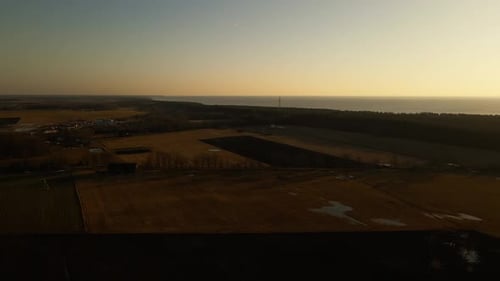 A Sunset Sky Over the Ocean with Clouds and Water Meeting at the Horizon