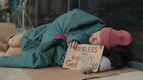 Sleeping Tramp with Sign Homeless and Hungry