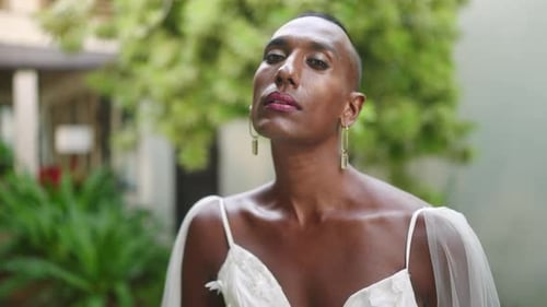 Elegant Model Poses in White Wedding Dress Outdoors