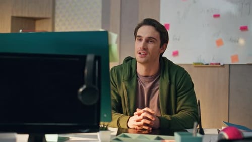 Friendly Creator Greeting Computer Videocall at Office Smiling Guy Waving Hand