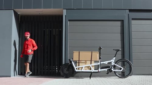 Delivery Man with Boxes on Bicycle in the City