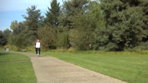 Senior Man Riding a Bicycle 60s