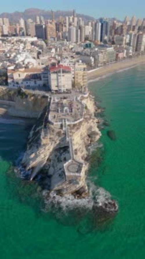 Vertical Aerial Drone Panning Shot Of Balcon Del Mediterraneo Skyscrapers, Beach And Sea