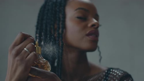 Woman Sprays Perfume