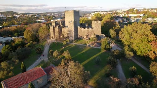 Far to close up aerial shot of the Castle of Guimaraes