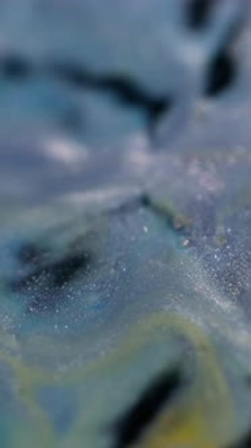 Swirling colors of blue, black, and yellow