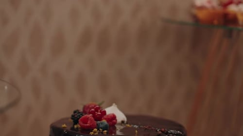 Chocolate Cake Slice with Fresh Berries and Knife