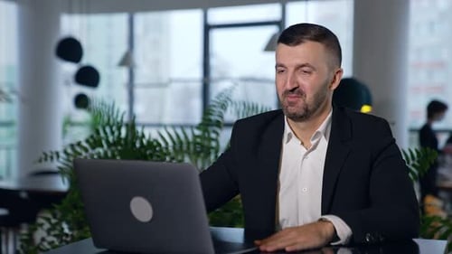 Man Having Video Call in Modern Office