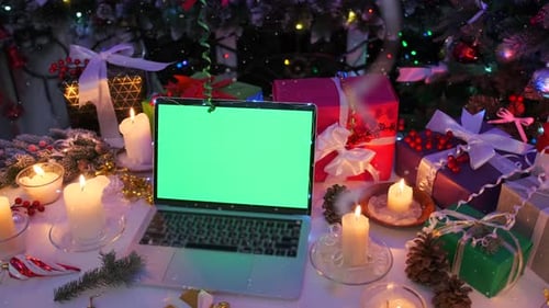 Close up computer with green screen place for advertising offers and sales on table