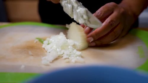 Close Up Chopping Onion in the Kitchen