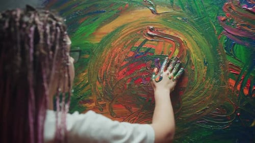 Artist Creating Abstract Art with Hand Painting