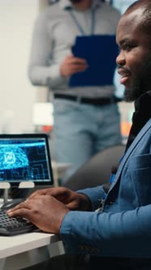 Man Typing in Modern Workplace