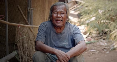 Senior Man Smiling Outdoors on a Sunny Day