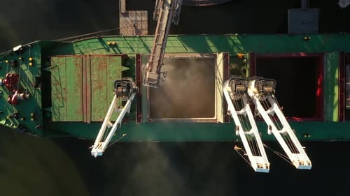 Aerial View Fom Above Wheat Loading to Bulker Ship Cargo Hold at Sea Grain Elevator in Sea Port