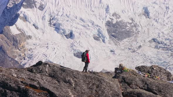 Experienced Mountaineer Traversing Rocky Himalayan Ridge Overlooking ...