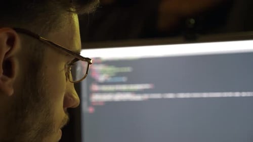 Profile of Male Financial Analyst Working on Computer at Evening Time Young Analytic Trading Online