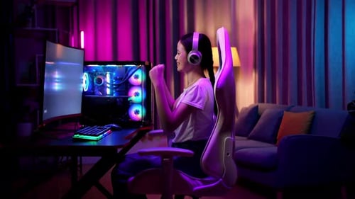 Teen Gamer Playing and Winning a Video Game