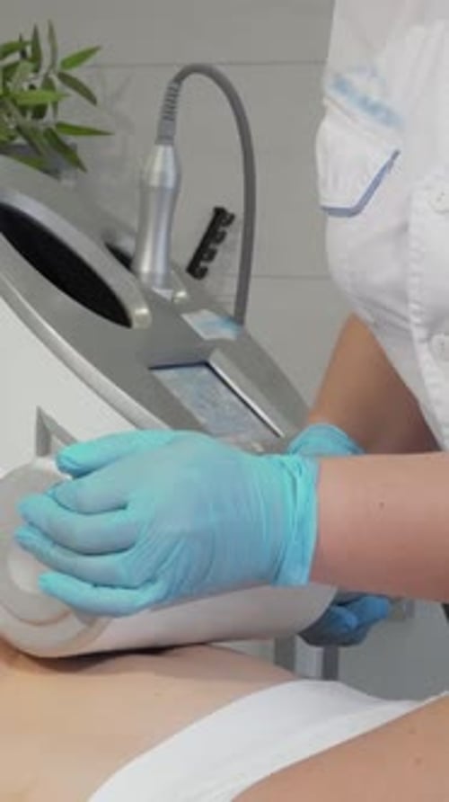 Mature Woman Enjoying a Rejuvenating Endospheres Massage at a Modern Beauty Clinic