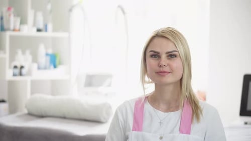 Blonde Woman Smiling in a Medical Clinic