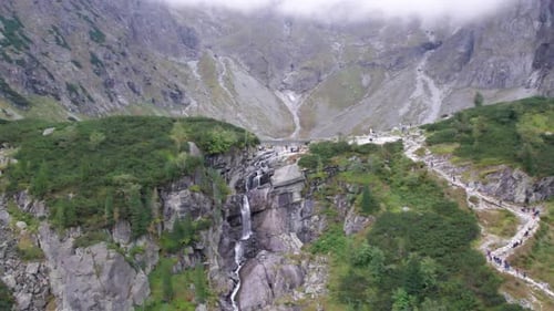 hiking climb high mountain hard steep climb waterfall mountain lake