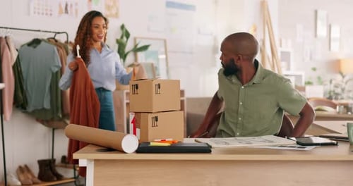 Designers Discussing Fashion Designs in Modern Office