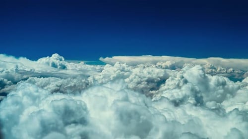 Epic view of cotton clouds from above, high altitude cloud formation overview