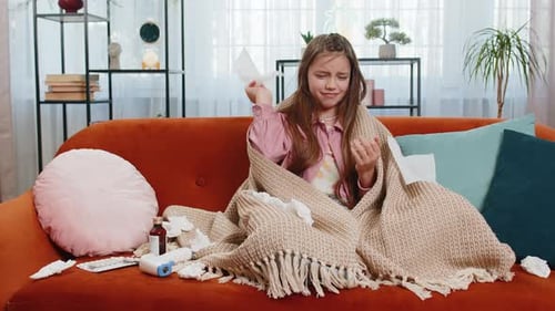 Young Girl Sitting on Couch, Sick with a Cold
