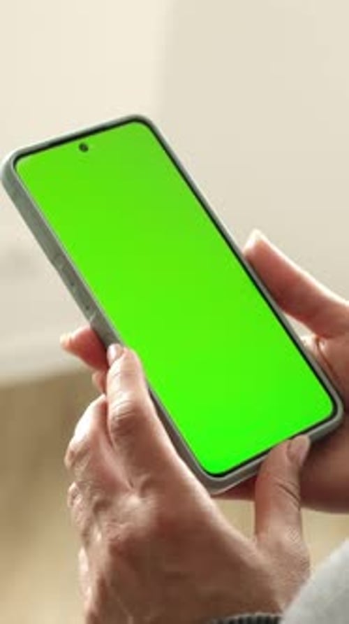 Girl Holding Smartphone With Green Chromakey Screen