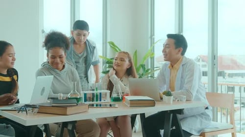 Science Class Discussing Experiment in Classroom