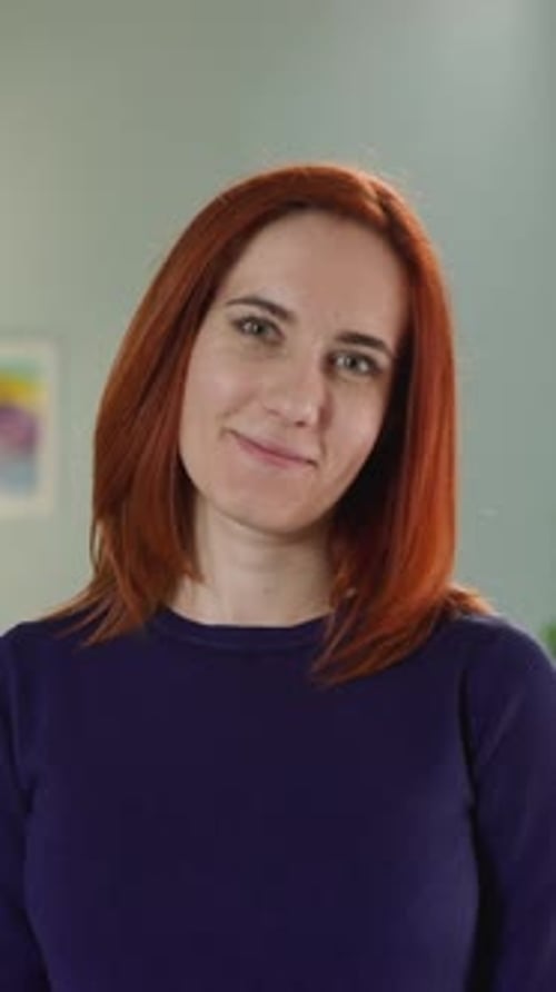 Smiling Woman with Red Hair Close Up Portrait