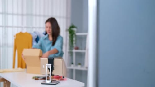 Woman Packing Online Retail Order for Fashion Vlog
