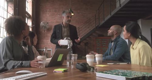 Tech Team Discussing VR in a Modern Workplace