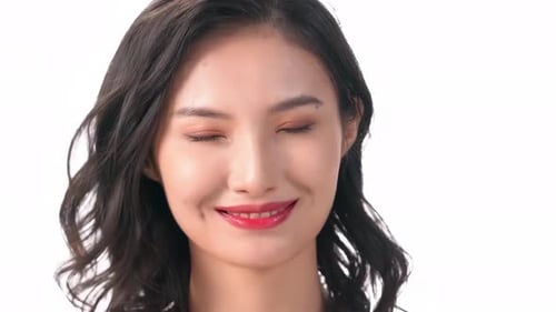 Smiling Woman with Wavy Hair in Studio