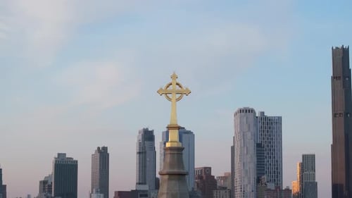 Aerial view of a crucifix on a church steeple in Brooklyn