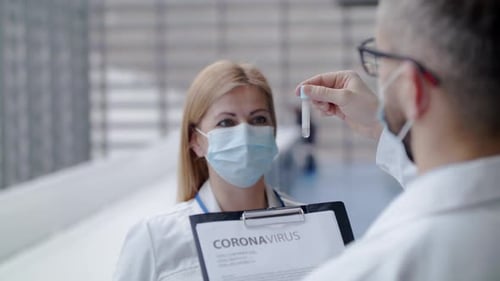 Medical Professionals Discussing Coronavirus Test Results in Hospital