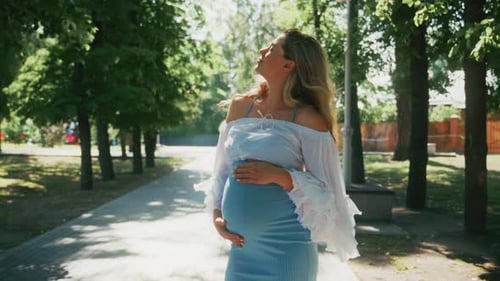 Expecting Joy in the Park During a Sunny Afternoon Stroll