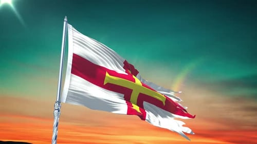 Waving Flag of Guernsey Against a Vibrant Sunset Sky